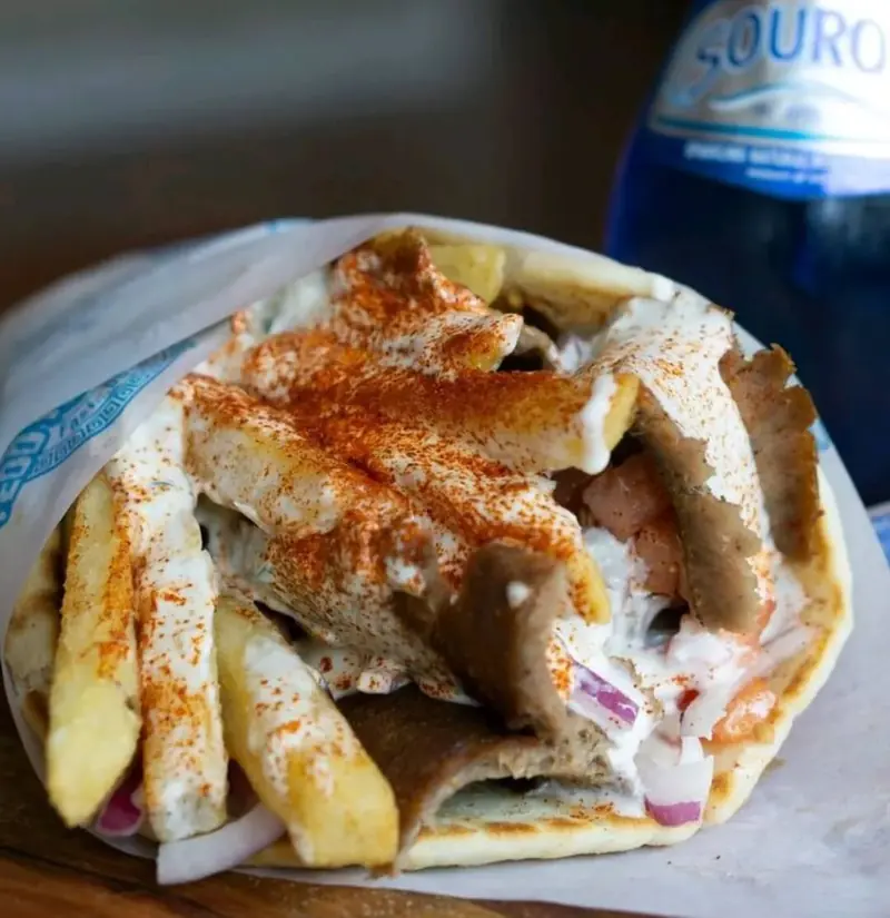 Gyro wrapped with fries, tzatziki and a dusting of spice