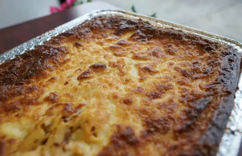 Baked pastitsio, golden and bubbling in the tray