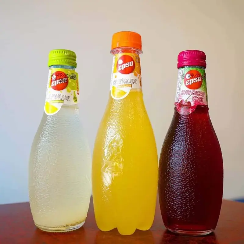 Three bottles of Greek soda: lemonade, orange and cherry